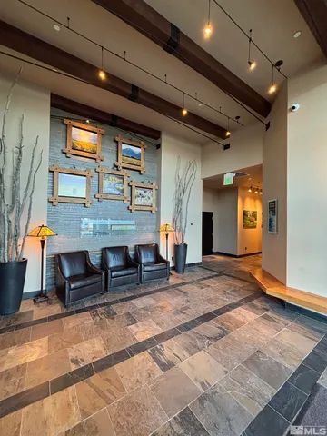 a view of a hall with couches and dinning table