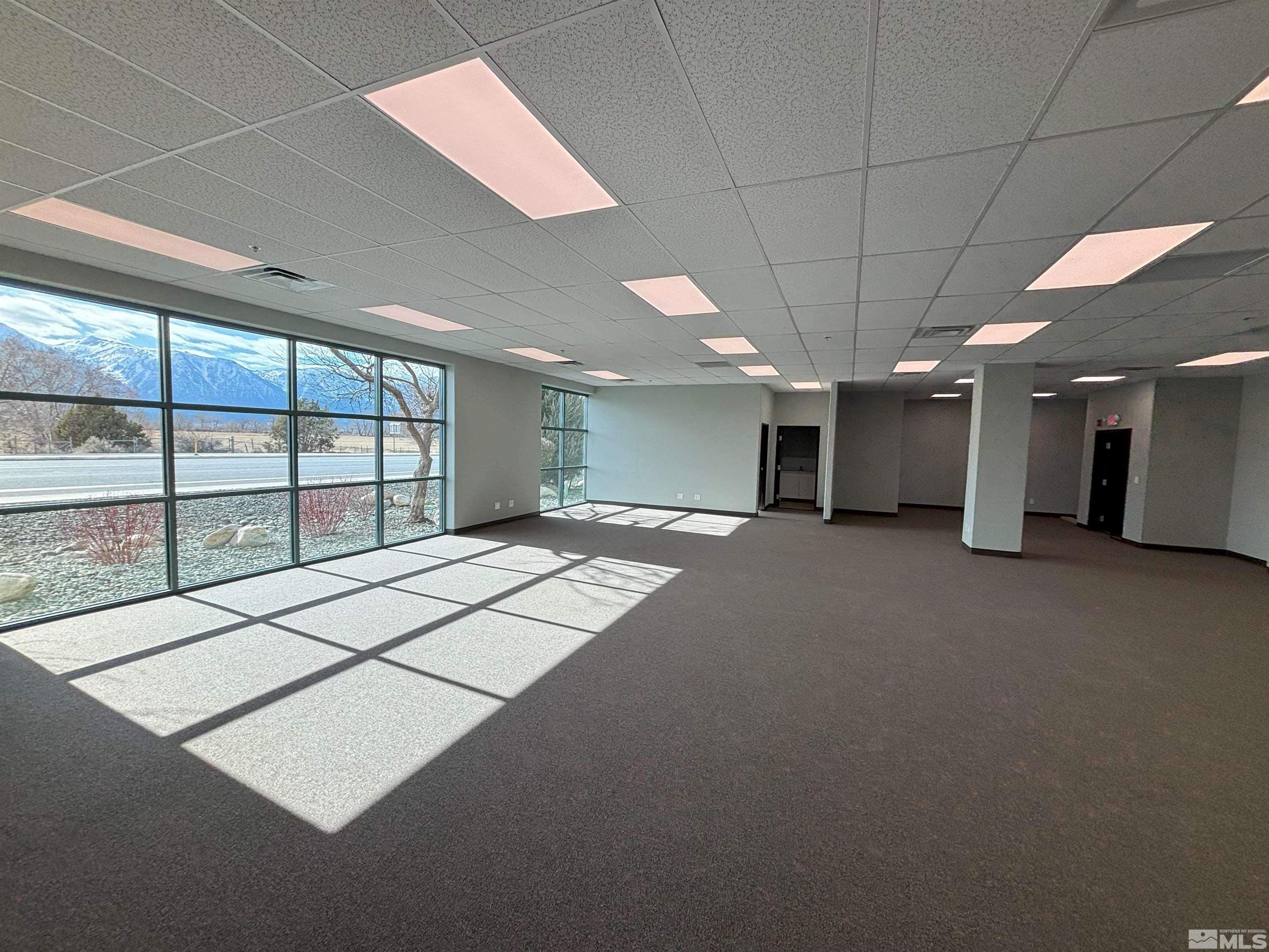 1516 Charlotte Way, Unit B Gardnerville, NV 89410 - Photo 9 of 17 a view of an empty room with a window