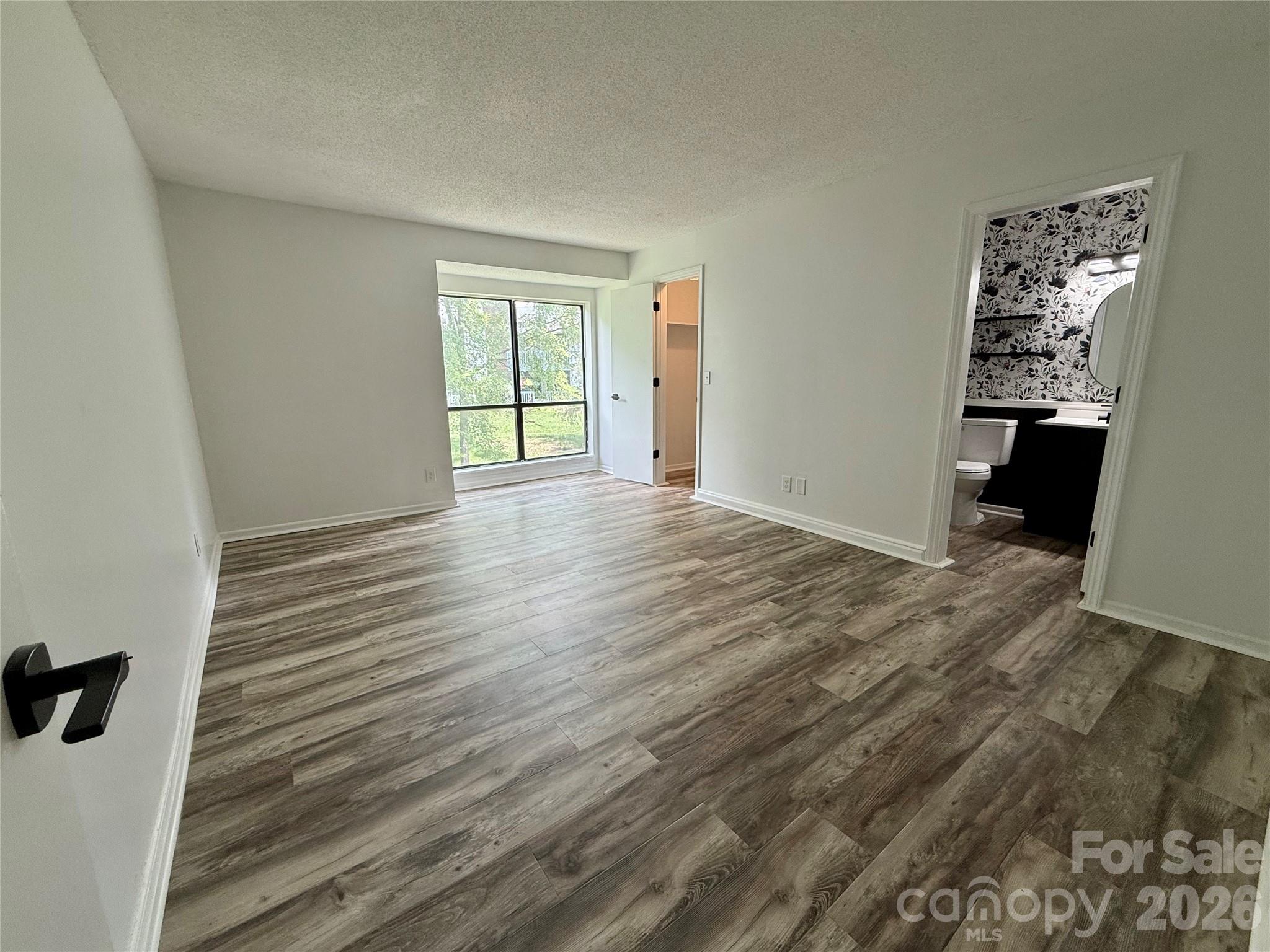 11023 Harrowfield Road Charlotte, NC 28226 - Photo 20 of 32 a view of an empty room with a window