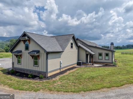 186 Rice Landing Hayesville, NC 28904 - Photo 14 of 77 a view of a house with backyard