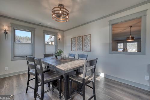 186 Rice Landing Hayesville, NC 28904 - Photo 50 of 77 a view of a dining room with furniture window and wooden floor