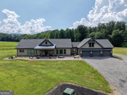 186 Rice Landing Hayesville, NC 28904 - Photo 5 of 77 a front view of a house with garden