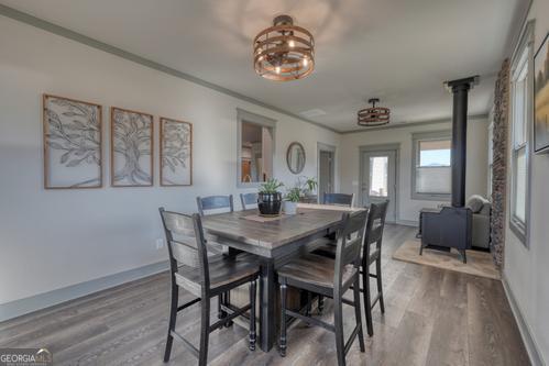 186 Rice Landing Hayesville, NC 28904 - Photo 51 of 77 a view of a dining room with furniture window and wooden floor