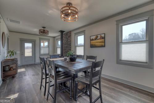 186 Rice Landing Hayesville, NC 28904 - Photo 52 of 77 a view of a dining room with furniture window and wooden floor