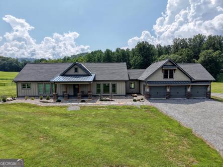 186 Rice Landing Hayesville, NC 28904 - Photo 6 of 77 a front view of a house with swimming pool yard and patio
