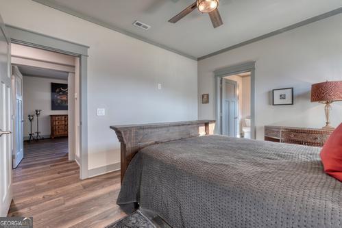 186 Rice Landing Hayesville, NC 28904 - Photo 63 of 77 a bedroom with a bed and a chandelier