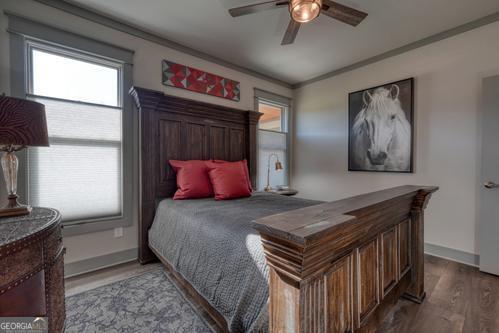 186 Rice Landing Hayesville, NC 28904 - Photo 64 of 77 a bedroom with a bed and a chandelier