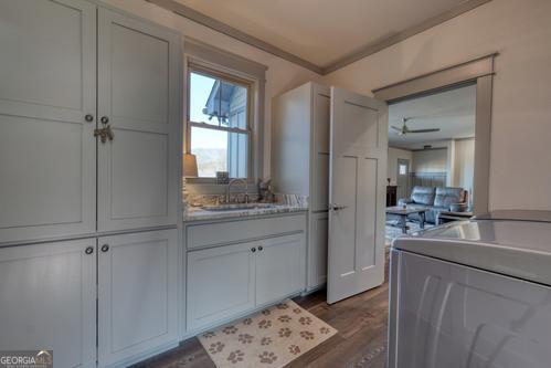 186 Rice Landing Hayesville, NC 28904 - Photo 70 of 77 a bathroom with a granite countertop sink a mirror and a bathtub