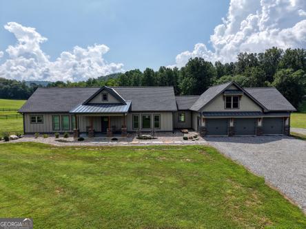 186 Rice Landing Hayesville, NC 28904 - Photo 76 of 77 a front view of a house with swimming pool yard and outdoor seating