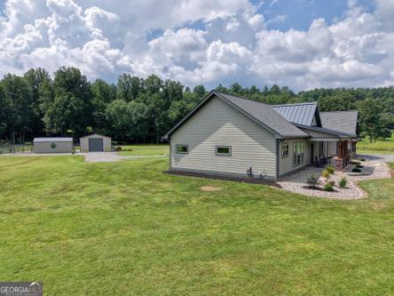 186 Rice Landing Hayesville, NC 28904 - Photo 10 of 77 a view of house with backyard and entertaining space