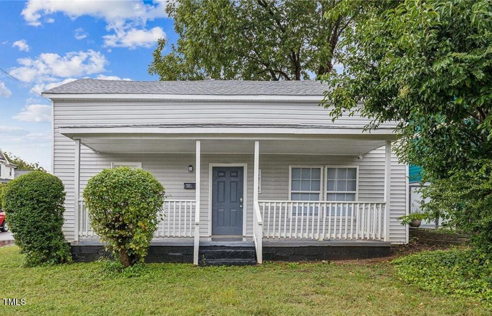 1512 Pender Street Raleigh, NC 27610 - Photo 2 of 12 a view of a house with a balcony and garden