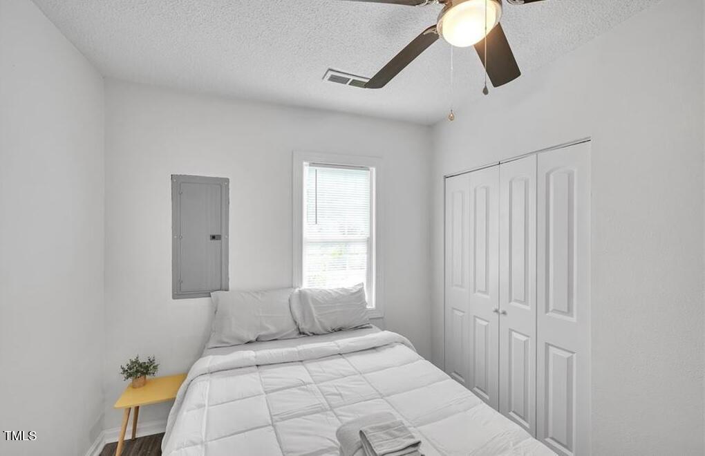 1512 Pender Street Raleigh, NC 27610 - Photo 10 of 12 a bedroom with a bed and a window