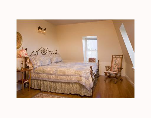 734 Corn Neck Road Block Island, RI 02807 - Photo 3 of 6 Master Bedroom. Gorgeous bamboo floors are found on the second floor as well. The Mansard style roof affords bedroom windows that are like portals looking out to sea!