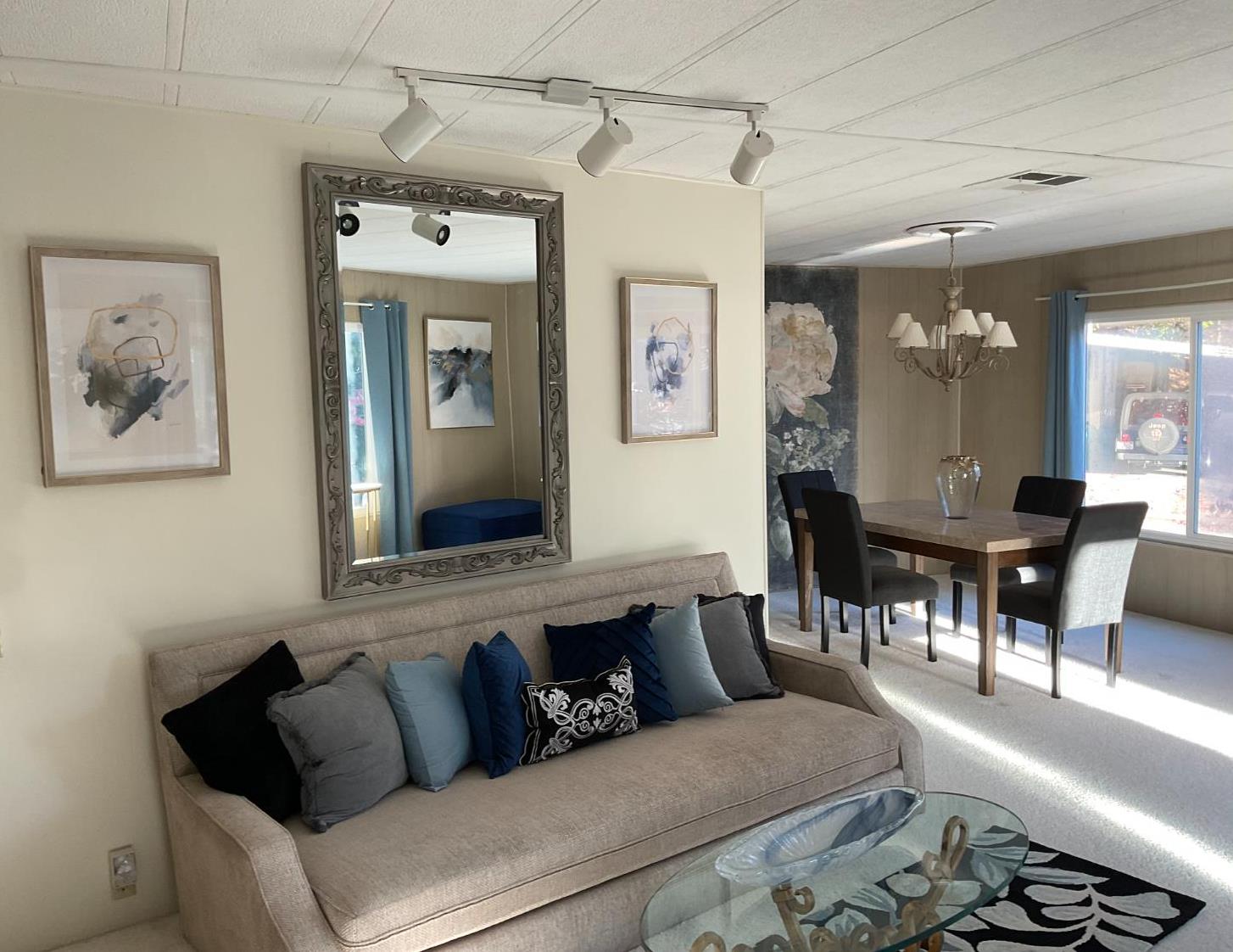 10124 Hidden Springs Drive Grass Valley, CA 95949 - Photo 1 of 27 a living room with furniture and a chandelier