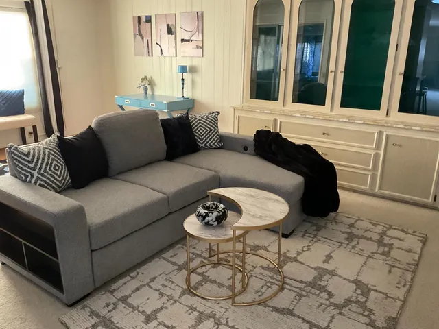 a living room with furniture and a window