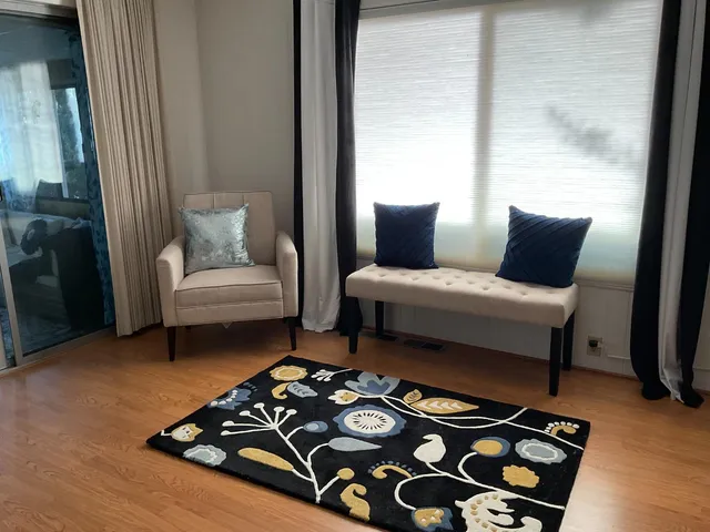 a bedroom with furniture and a window