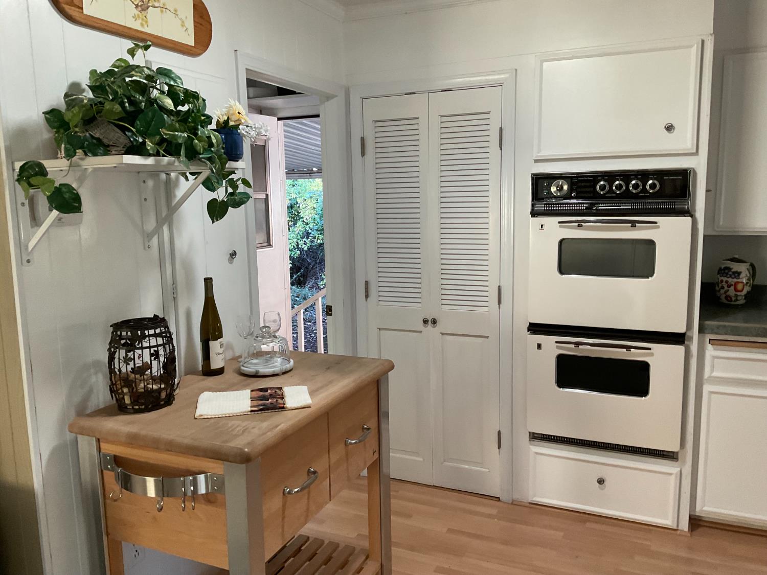 10124 Hidden Springs Drive Grass Valley, CA 95949 - Photo 19 of 27 a kitchen with a stove cabinets and wooden floor