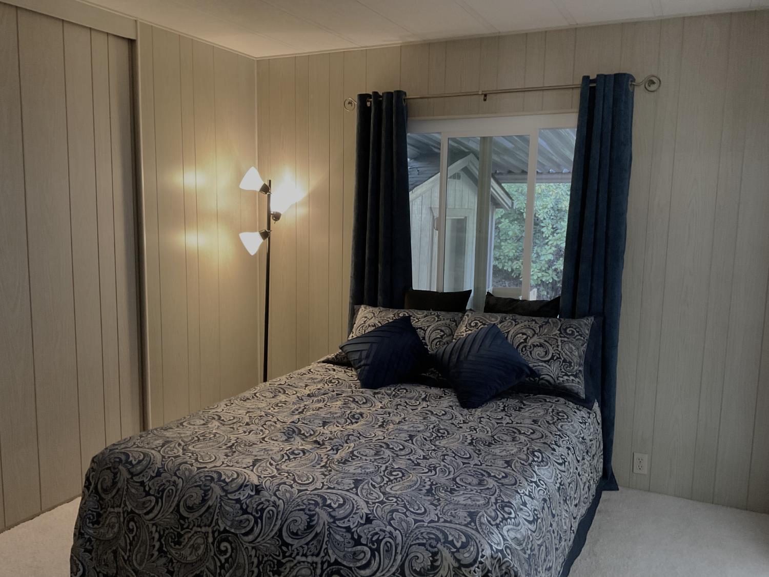 10124 Hidden Springs Drive Grass Valley, CA 95949 - Photo 23 of 27 a bedroom with a bed and a window