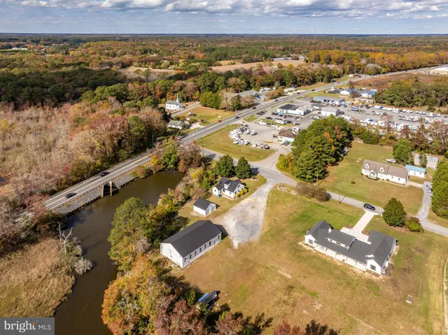 a view of a house with yard and a garden