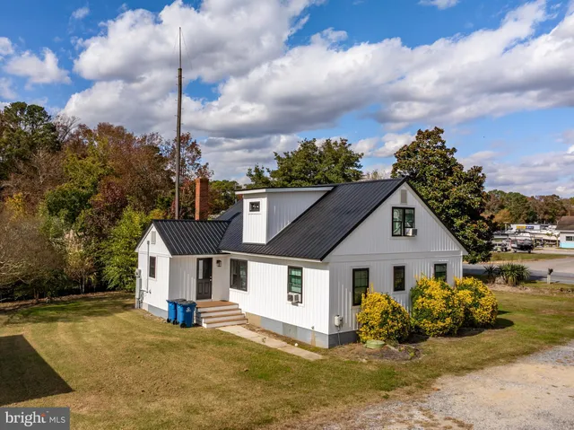 a aerial view of a house with a lake view