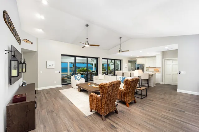 a view of a livingroom with furniture window and wooden floor