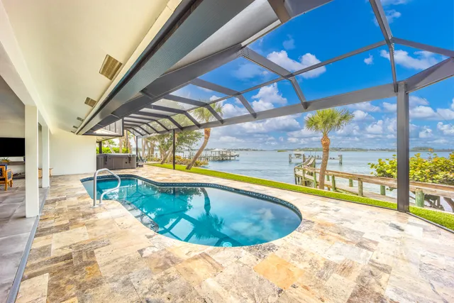 a view of a swimming pool with a patio