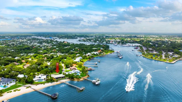 an aerial view of a house with swimming pool big yard and mountain view in back