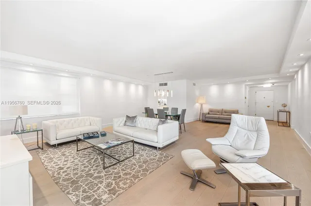 a kitchen with stainless steel appliances a refrigerator sink and stove top oven