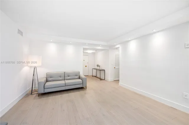 a kitchen with stainless steel appliances a sink stove and refrigerator