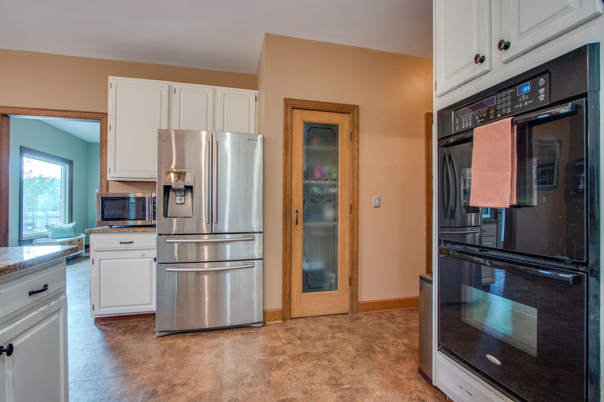 1105 Kathryn Road Mount Juliet, TN 37122 - Photo 12 of 30 a kitchen with stainless steel appliances a refrigerator and a stove top oven
