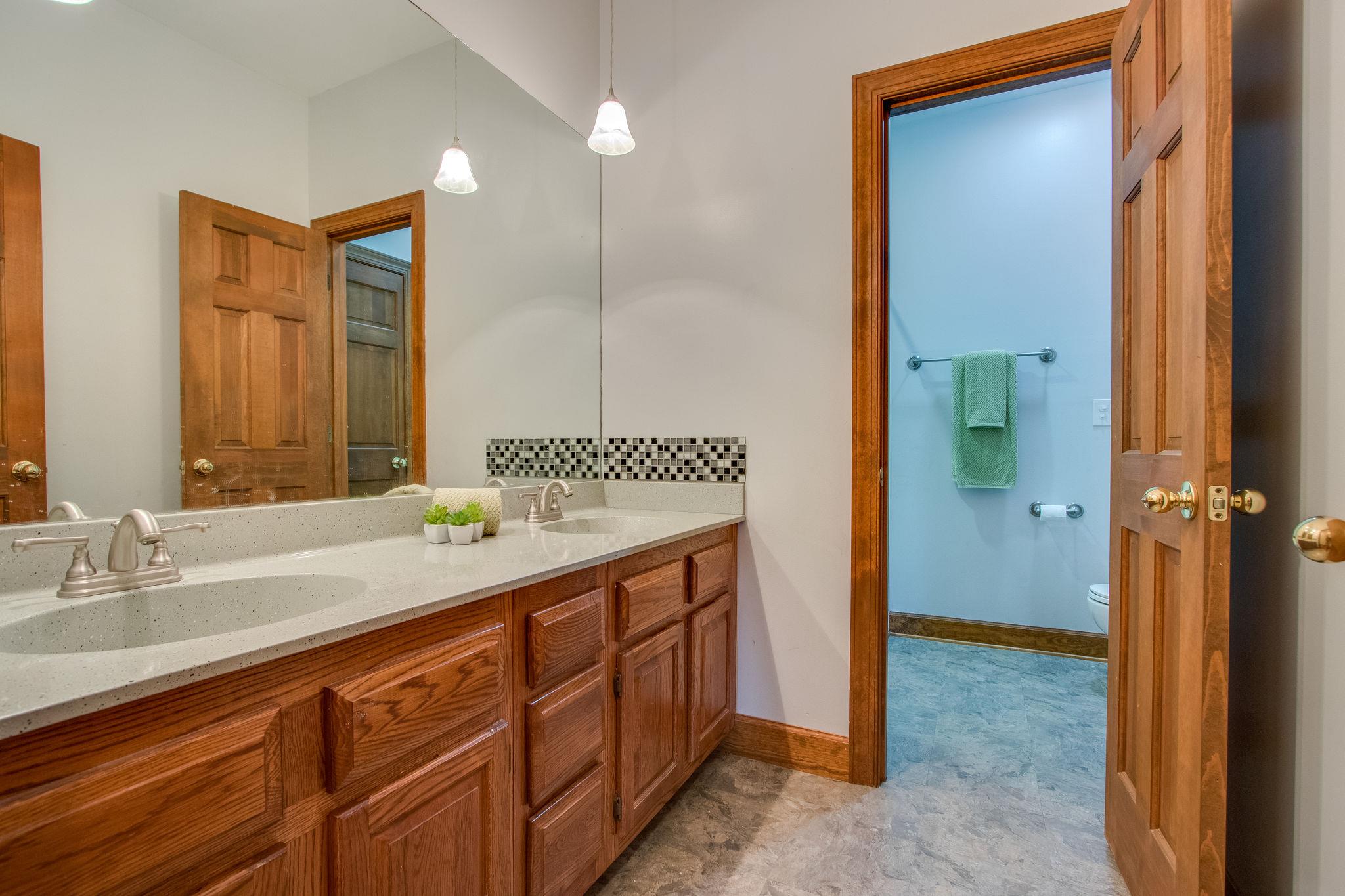 1105 Kathryn Road Mount Juliet, TN 37122 - Photo 20 of 30 a bathroom with a double vanity sink and a mirror