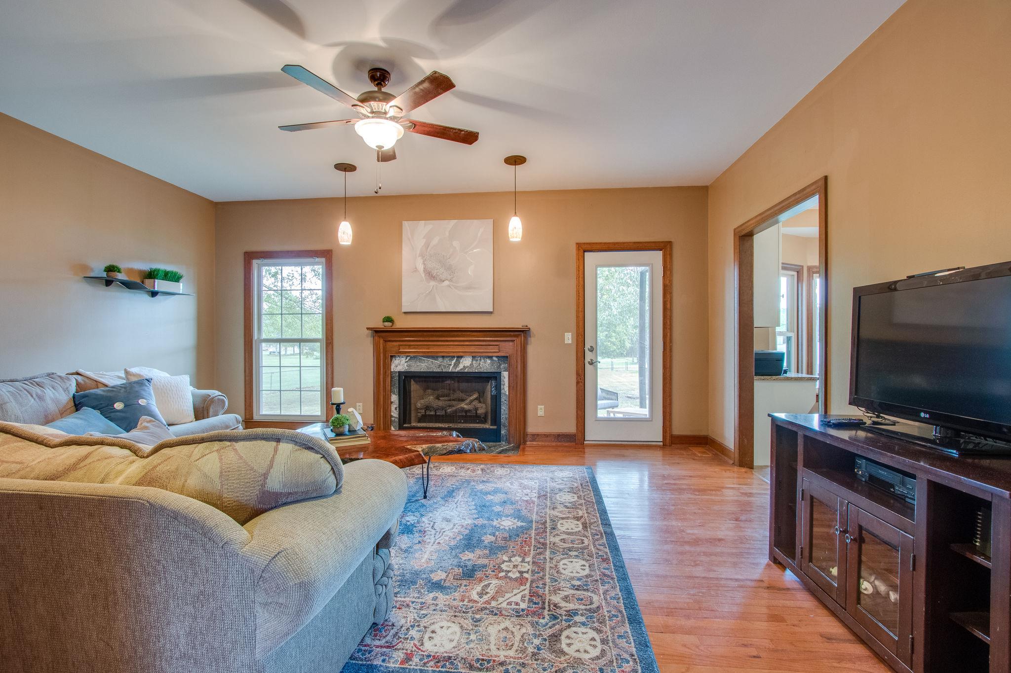 1105 Kathryn Road Mount Juliet, TN 37122 - Photo 6 of 30 a living room with furniture fireplace and flat screen tv