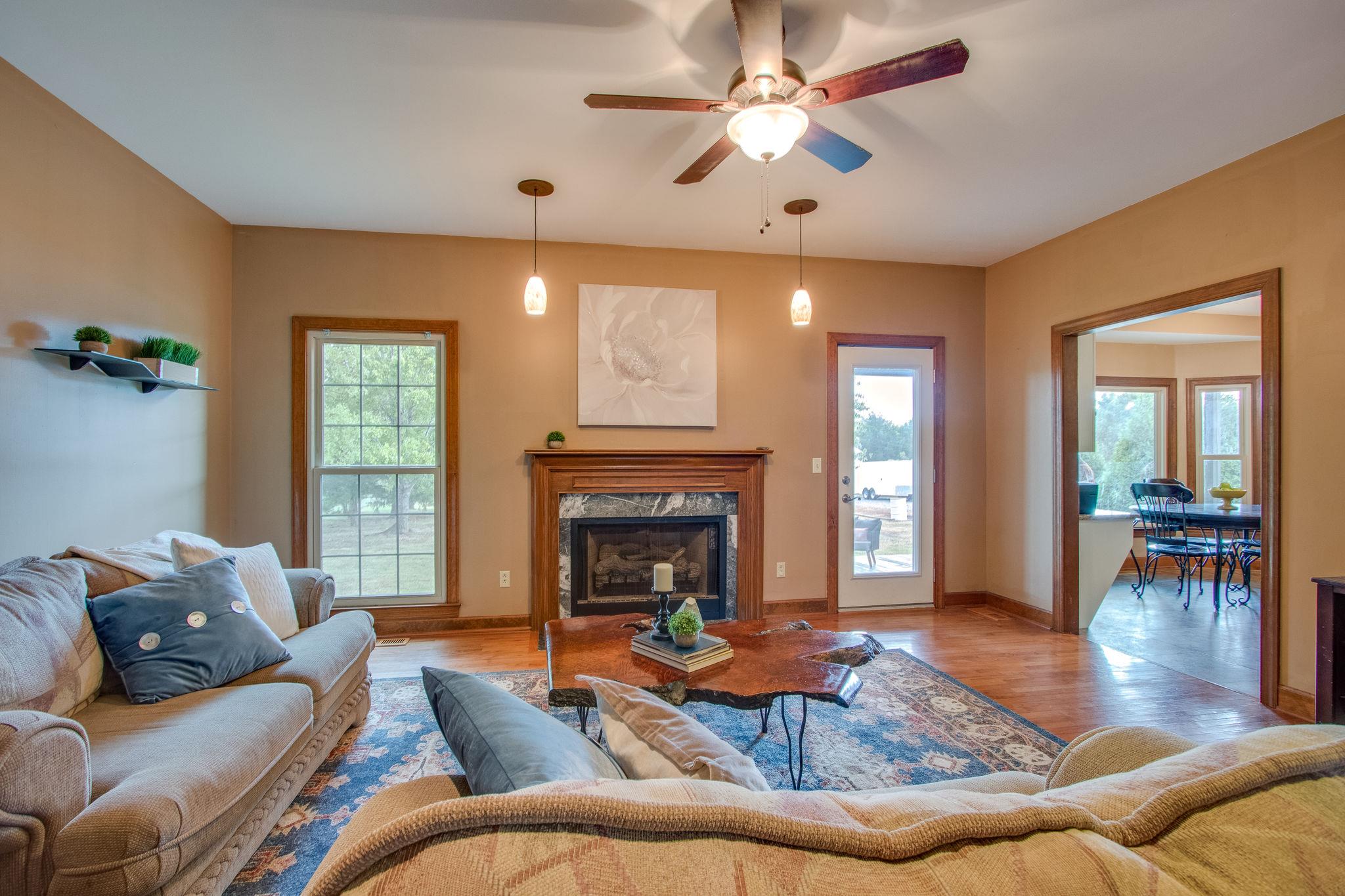 1105 Kathryn Road Mount Juliet, TN 37122 - Photo 7 of 30 a living room with furniture and a fireplace
