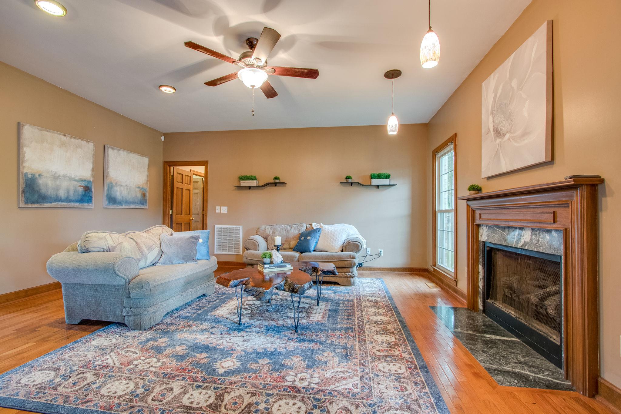 1105 Kathryn Road Mount Juliet, TN 37122 - Photo 8 of 30 a living room with furniture and a fireplace