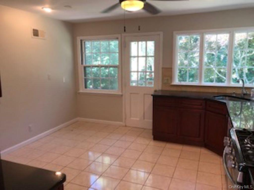 216 Mamaroneck Road Scarsdale, NY 10583 - Photo 6 of 16 Eat-in Kitchen w/door out to flagstone patio