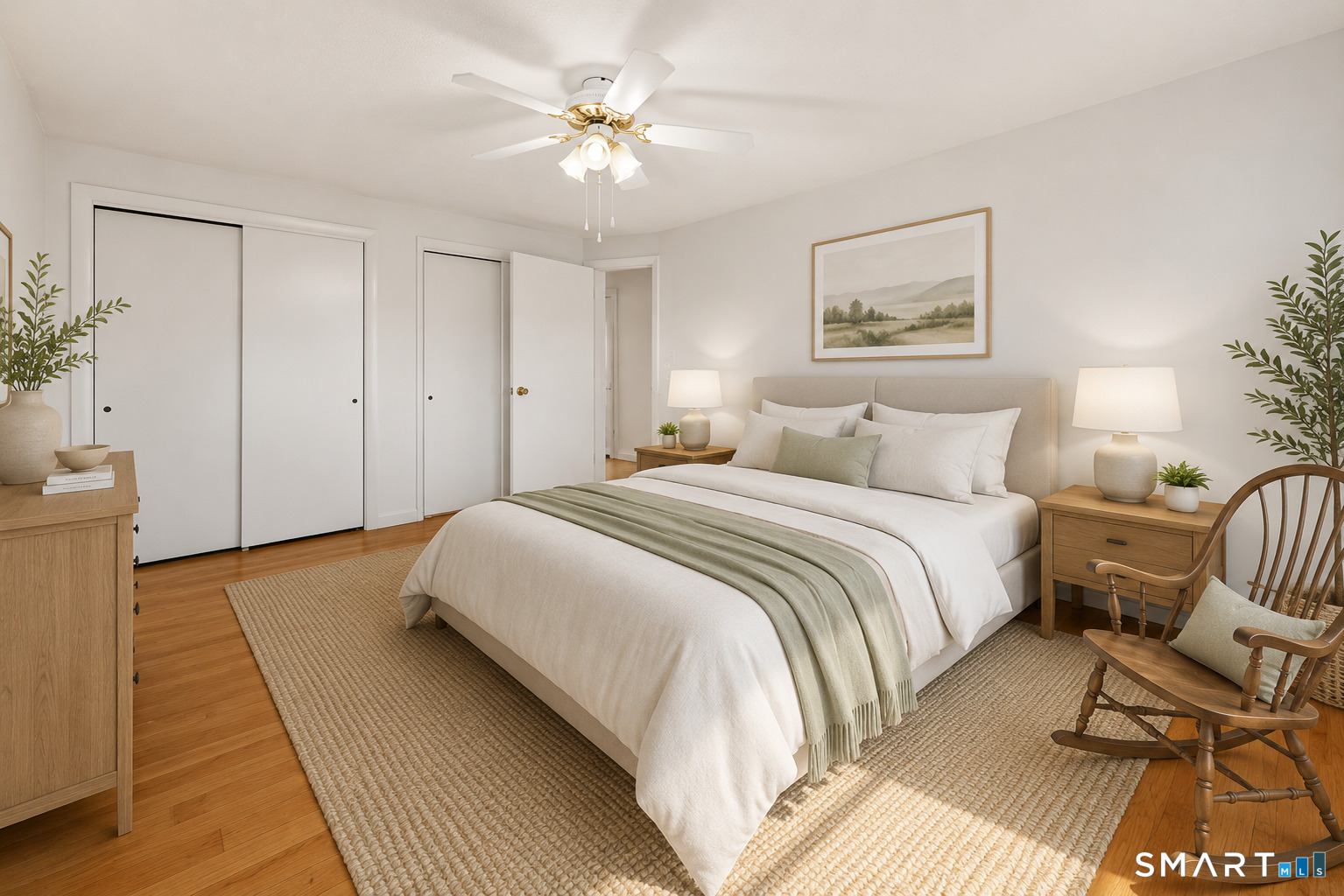 142 Wolcott Hill Road Wethersfield, CT 06109 - Photo 17 of 29 a bedroom with a bed and a chandelier