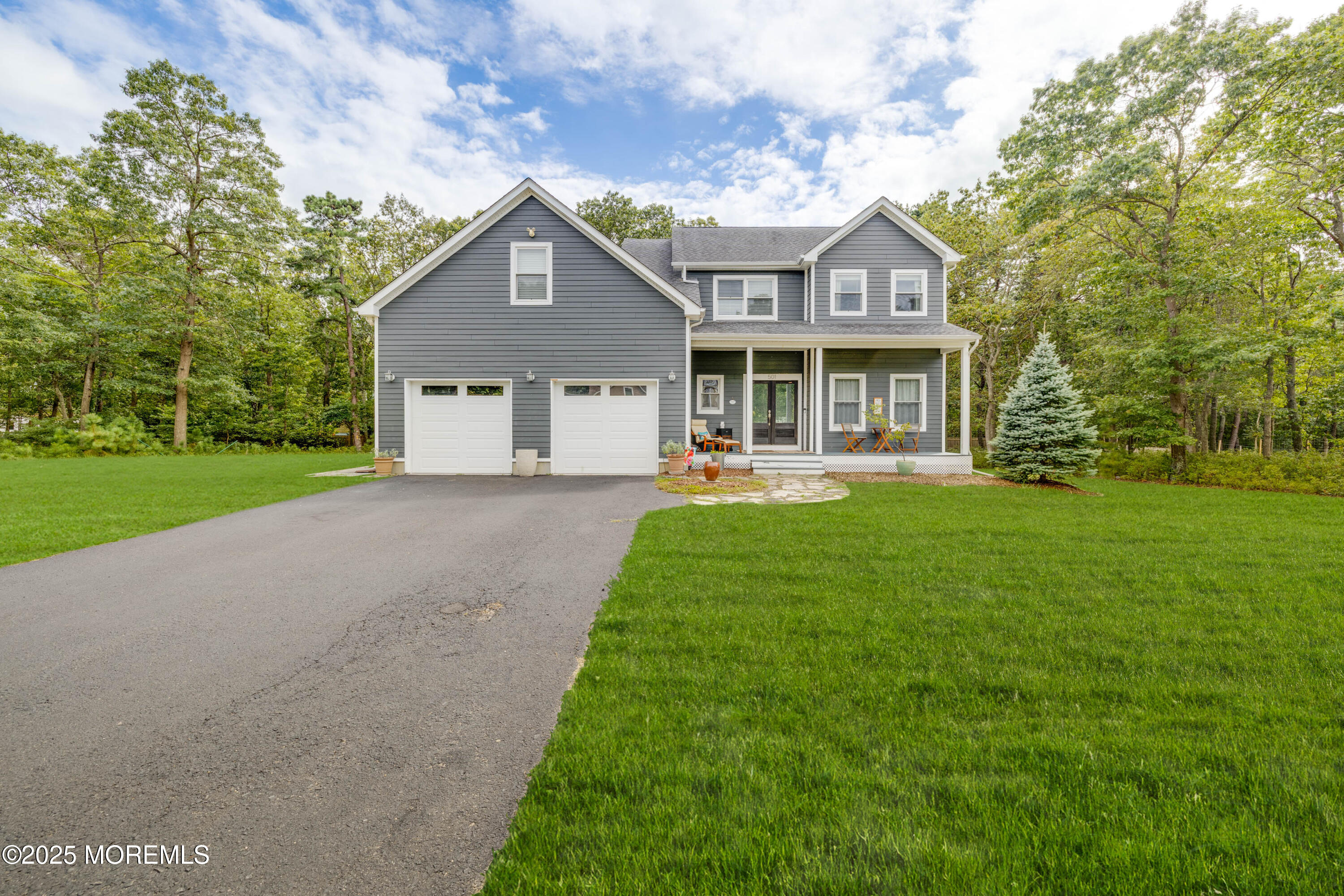 501 Newtons Corner Road Howell, NJ 07731 - Photo 1 of 29 a front view of a house with a yard and potted plants