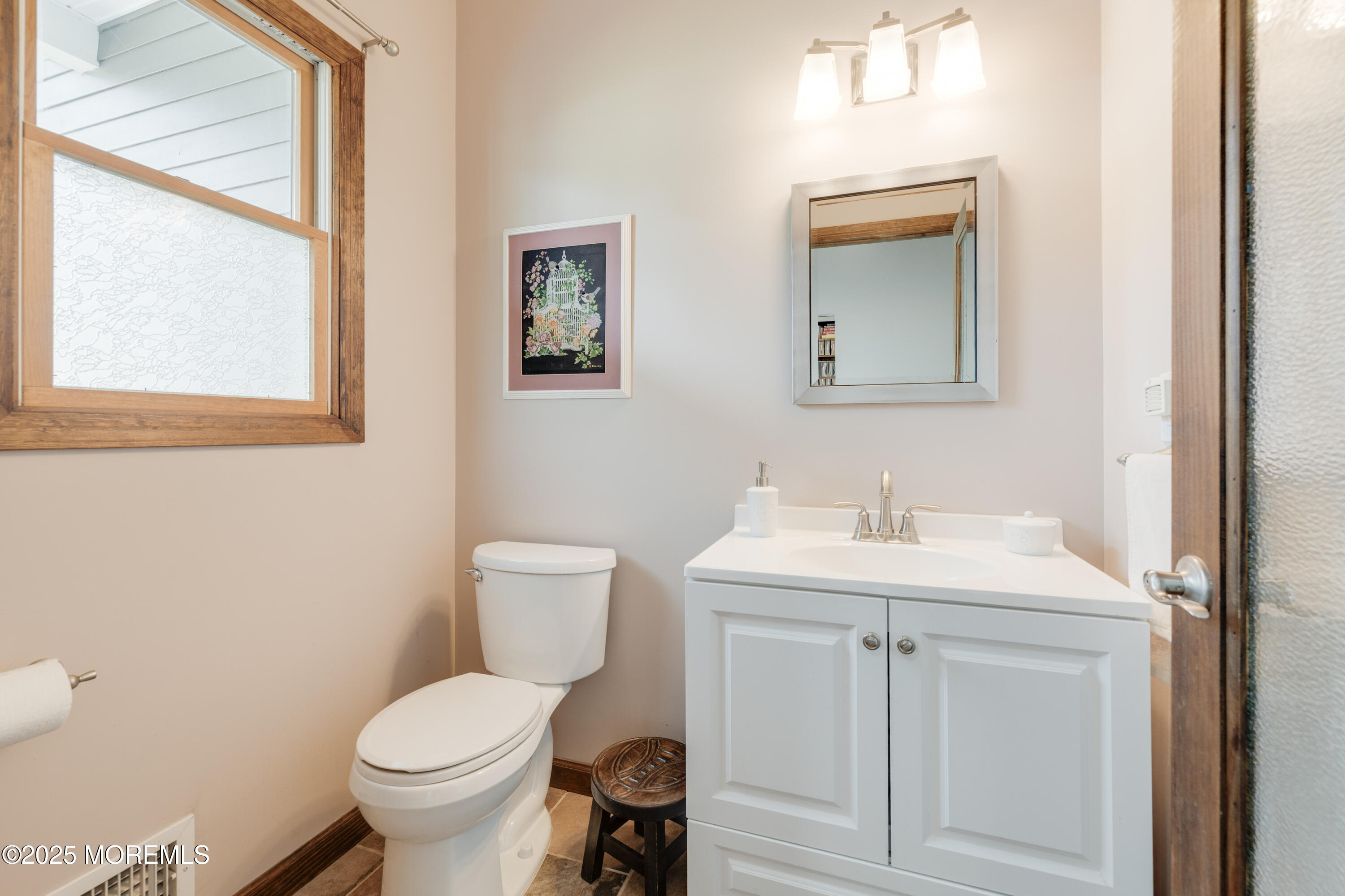 501 Newtons Corner Road Howell, NJ 07731 - Photo 12 of 29 a bathroom with a toilet sink and mirror