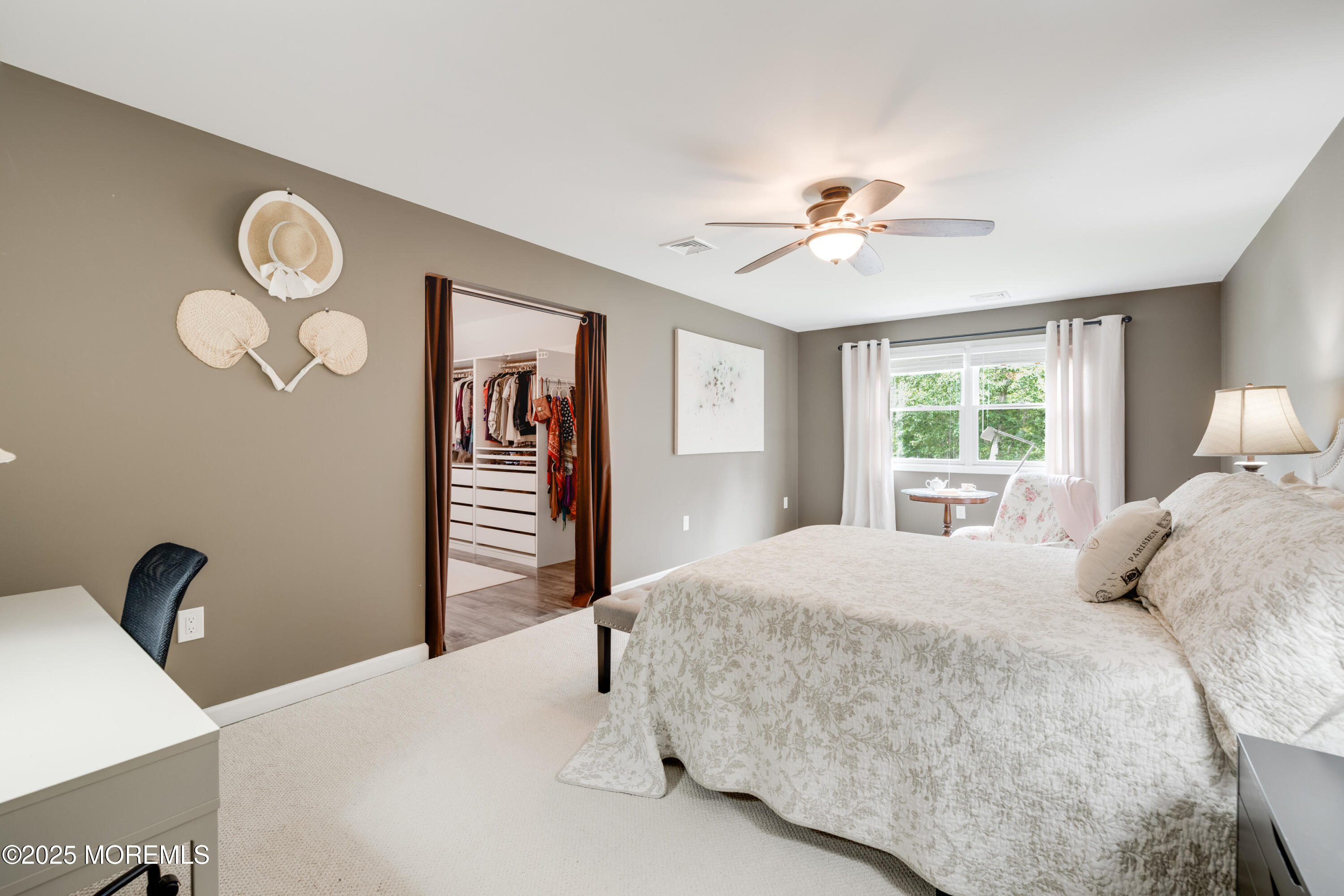 501 Newtons Corner Road Howell, NJ 07731 - Photo 13 of 29 a bedroom with a large bed and a chandelier