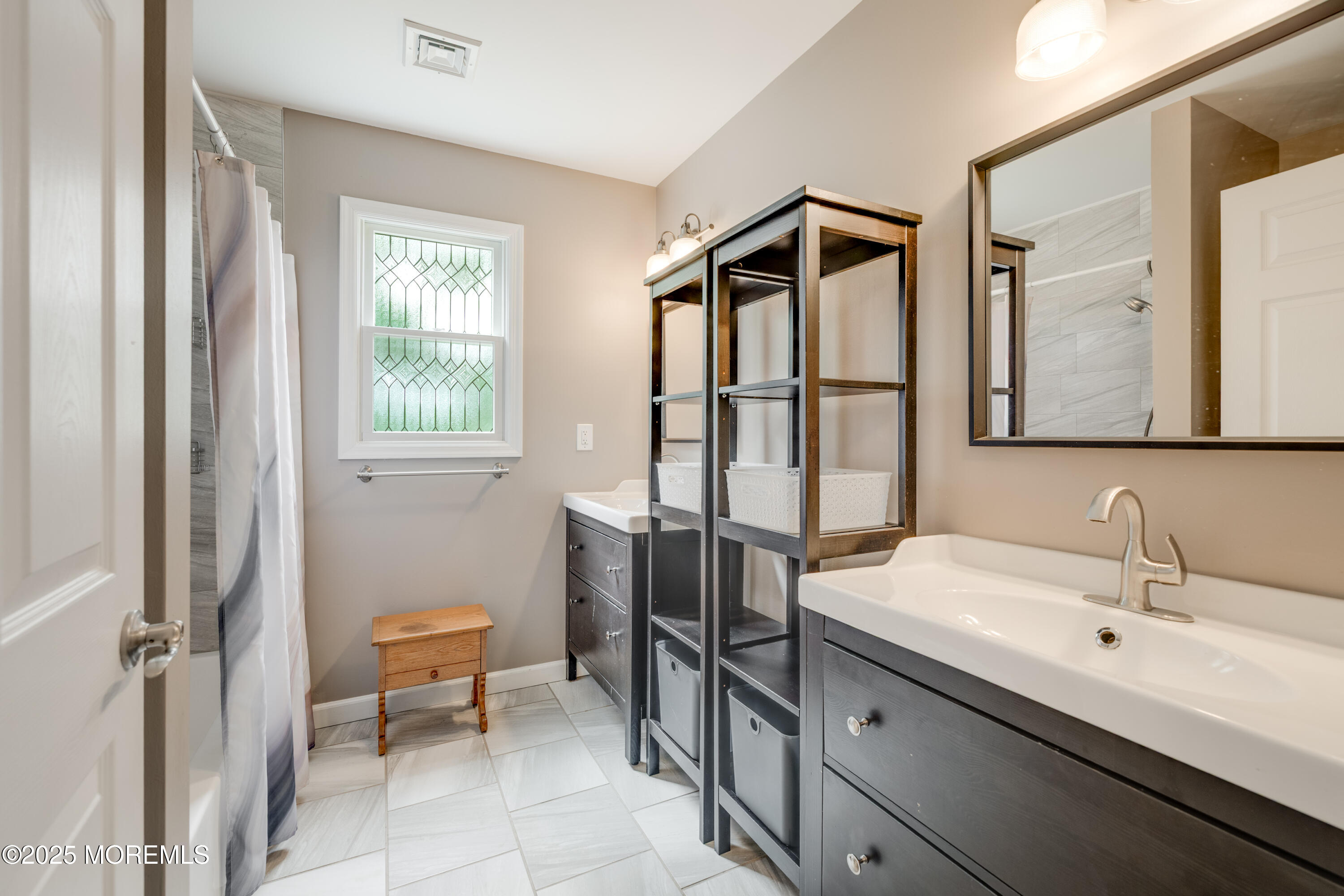 501 Newtons Corner Road Howell, NJ 07731 - Photo 23 of 29 a bathroom with a sink and a toilet