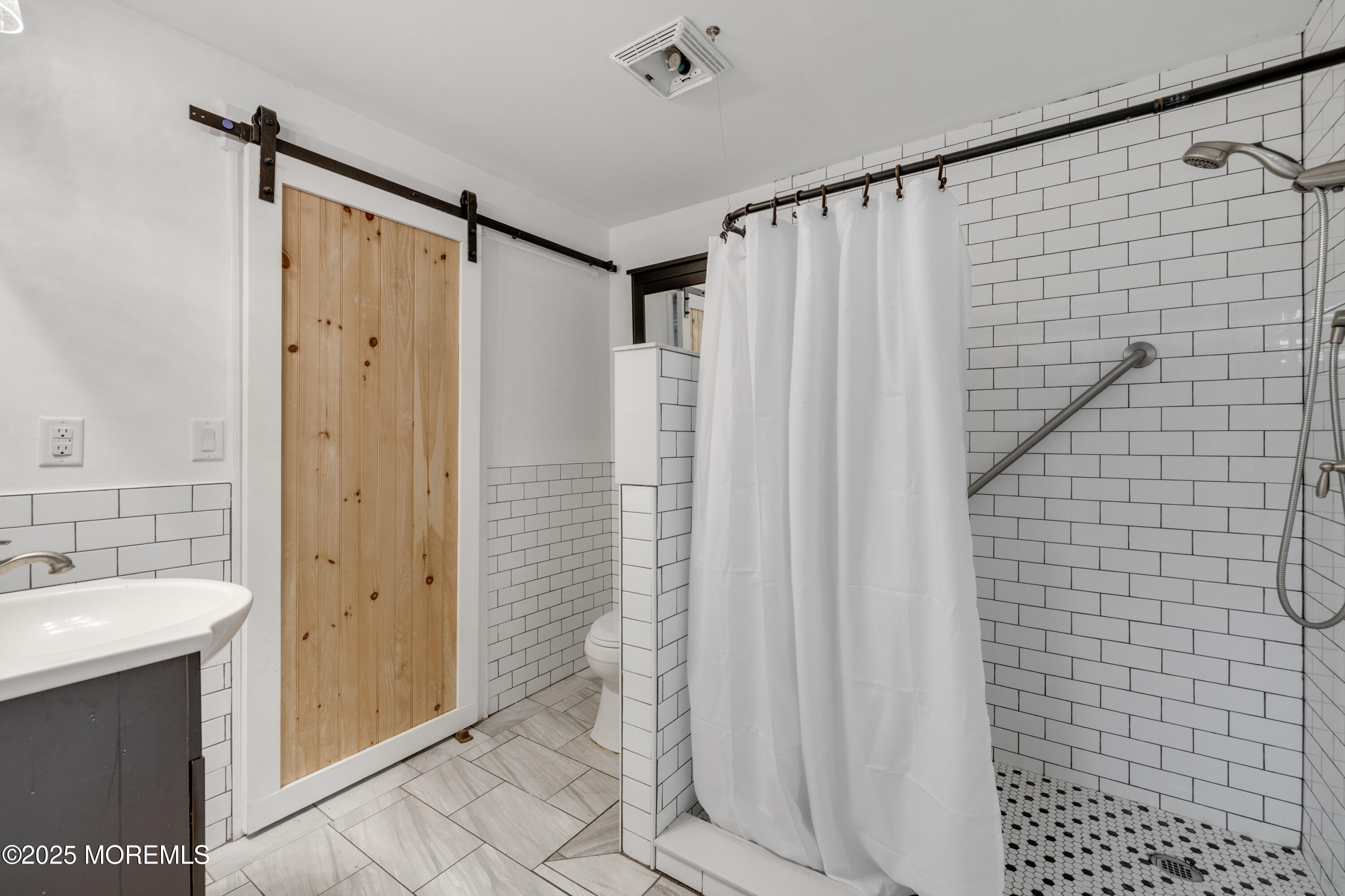 501 Newtons Corner Road Howell, NJ 07731 - Photo 26 of 29 a bathroom with a shower and a sink