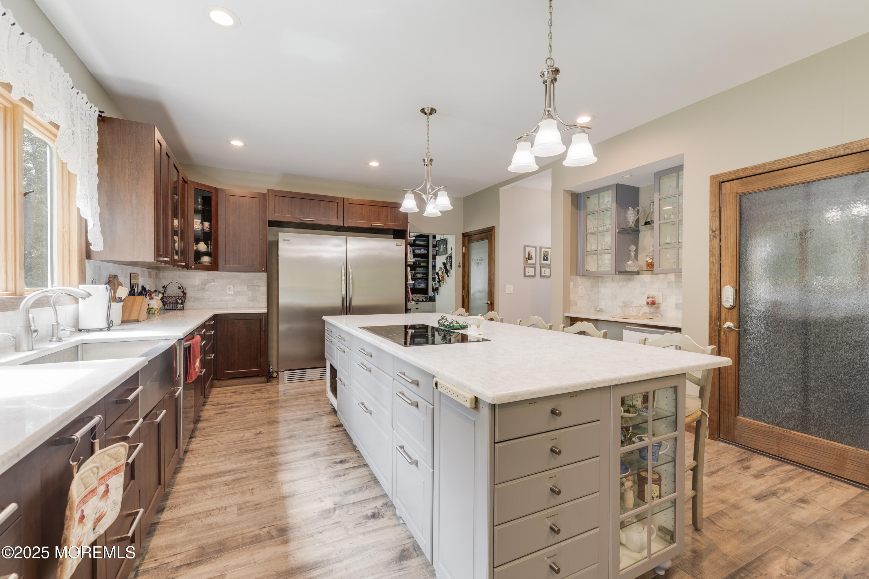 501 Newtons Corner Road Howell, NJ 07731 - Photo 6 of 29 a large kitchen with kitchen island a stove a sink a refrigerator and a chandelier