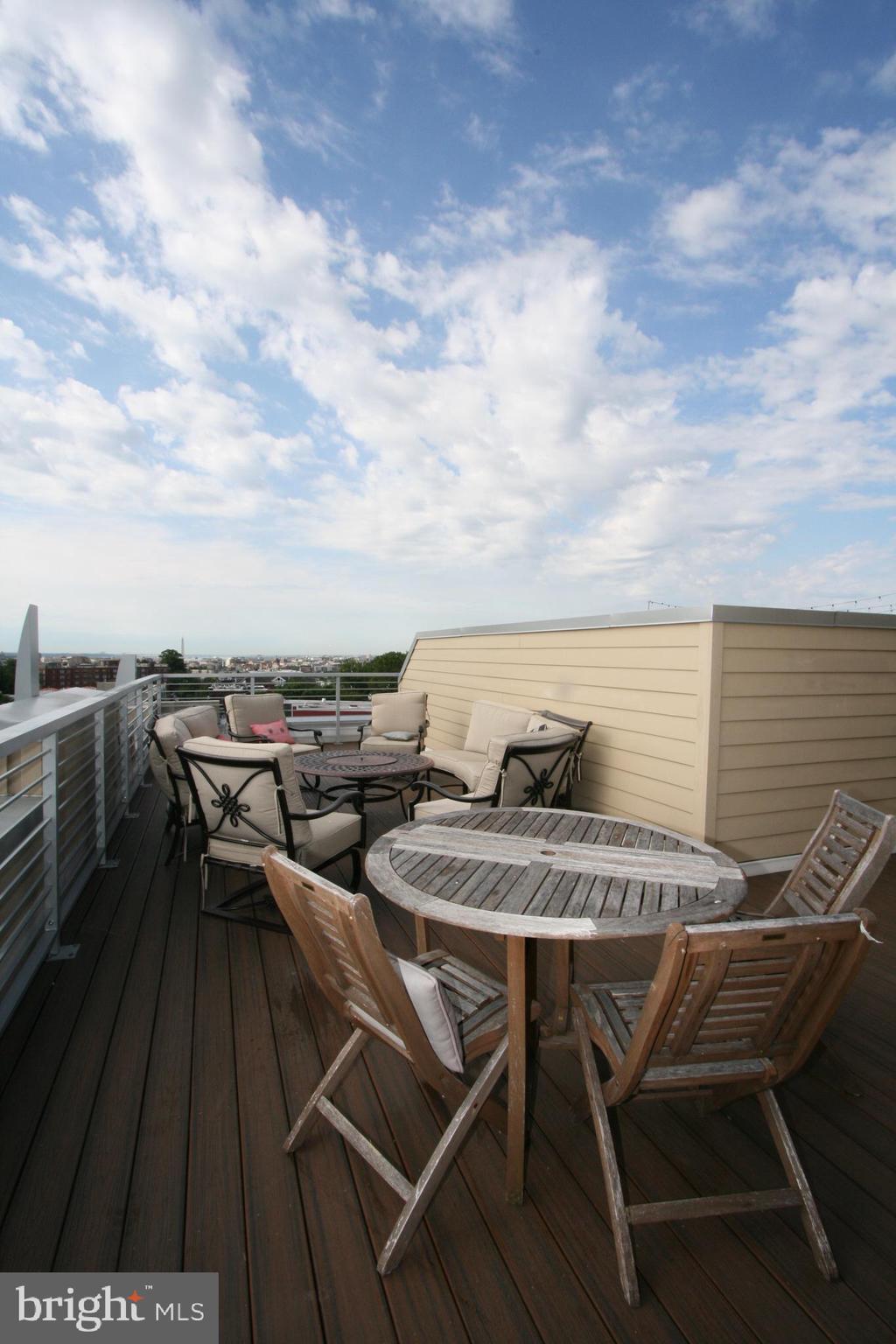 2550 17th Street Northwest, Unit 612 Washington, DC 20009 - Photo 29 of 55 a terrace of a house with outdoor seating