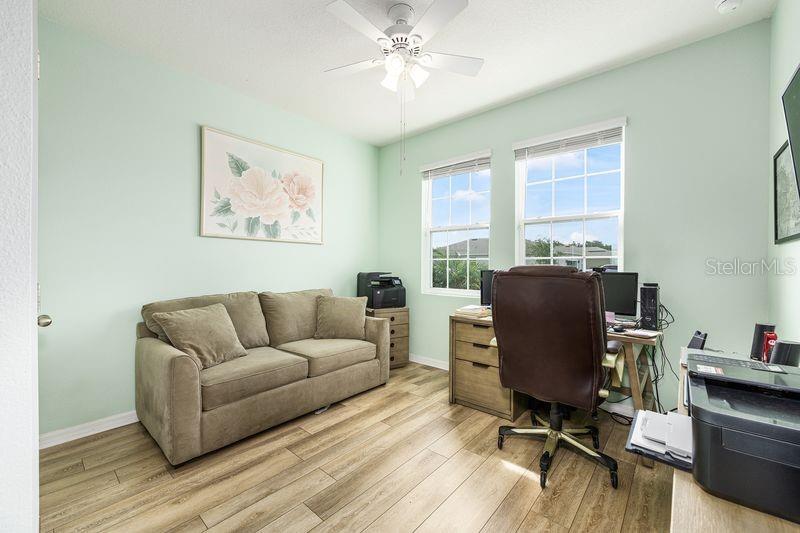 5077 Northeast 16th Street Ocala, FL 34470 - Photo 34 of 47 a living room with furniture and a window