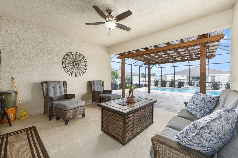 5077 Northeast 16th Street Ocala, FL 34470 - Photo 36 of 47 a living room with furniture and a large window