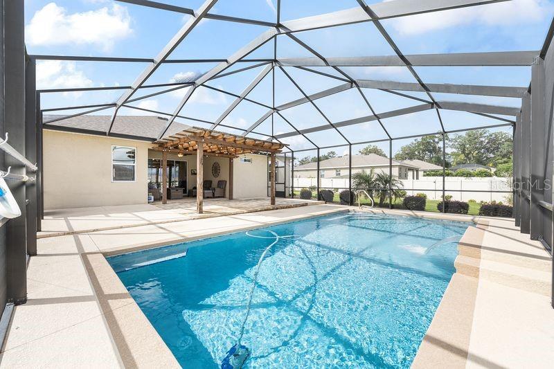 5077 Northeast 16th Street Ocala, FL 34470 - Photo 40 of 47 a view of a swimming pool with a outdoor seating