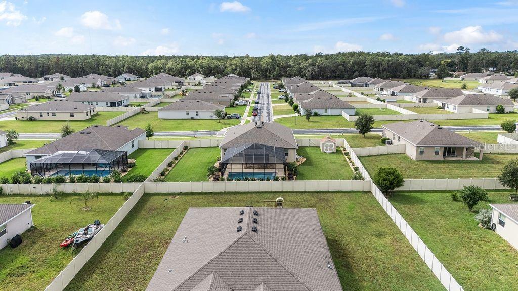 5077 Northeast 16th Street Ocala, FL 34470 - Photo 44 of 47 a view of a city with lawn chairs next to a yard
