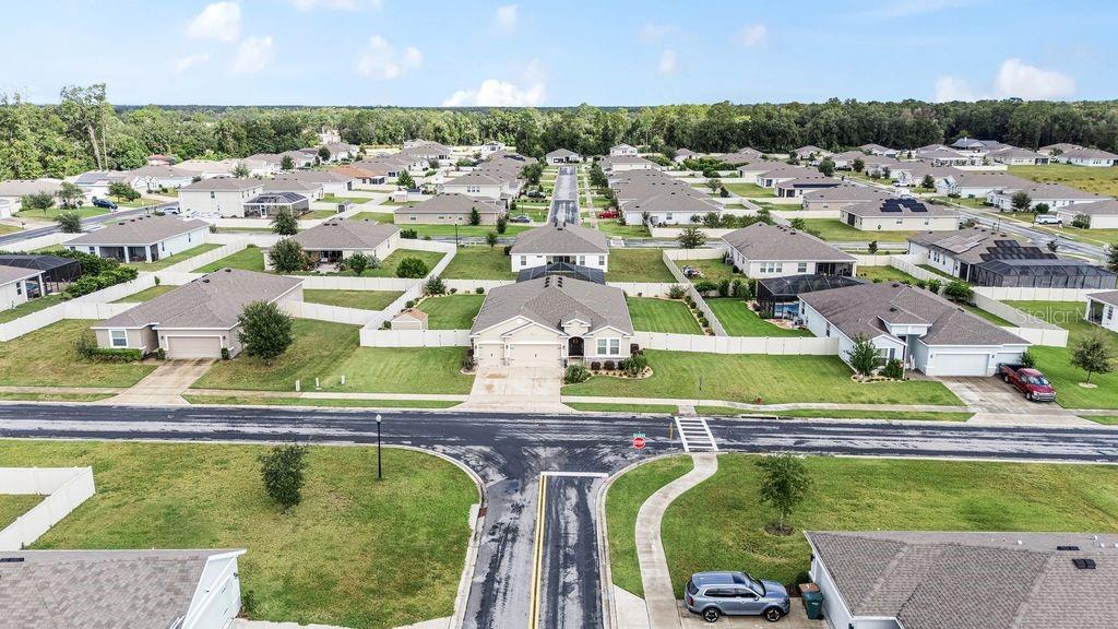 5077 Northeast 16th Street Ocala, FL 34470 - Photo 46 of 47 an aerial view of a swimming pool with outdoor seating and yard