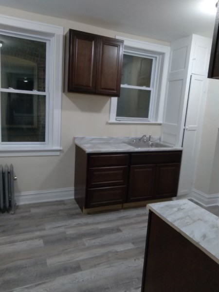 5017 West Cermak Road, Unit 7 Cicero, IL 60804 - Photo 3 of 6 a room with a sink and a mirror