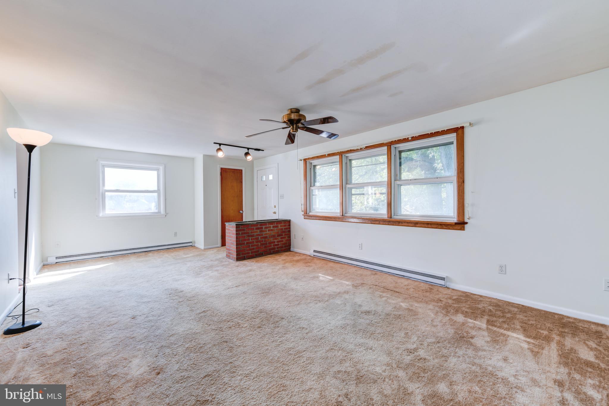 2476 Hopewell Road Elverson, PA 19520 - Photo 13 of 47 Living Room with Brick Planter and Ceiling Fan